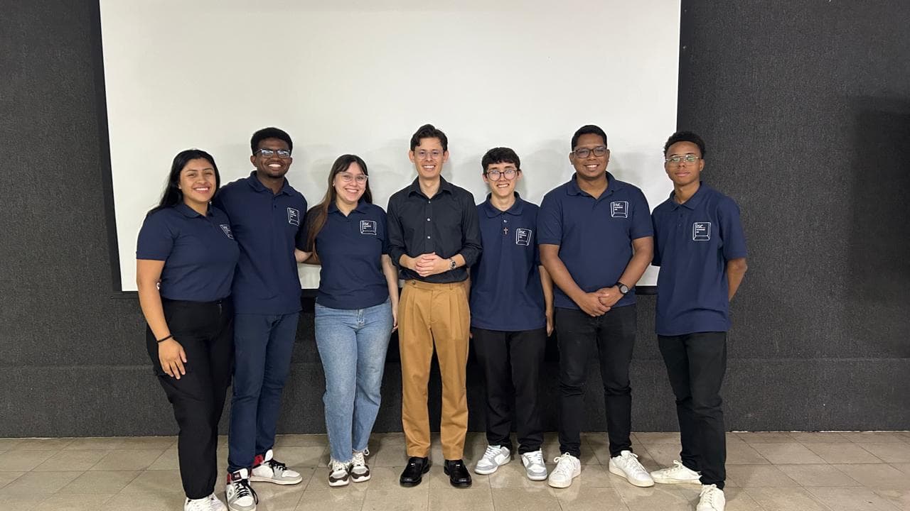 Picture of students wearing team uniform tshirts with Eduardo in the middle